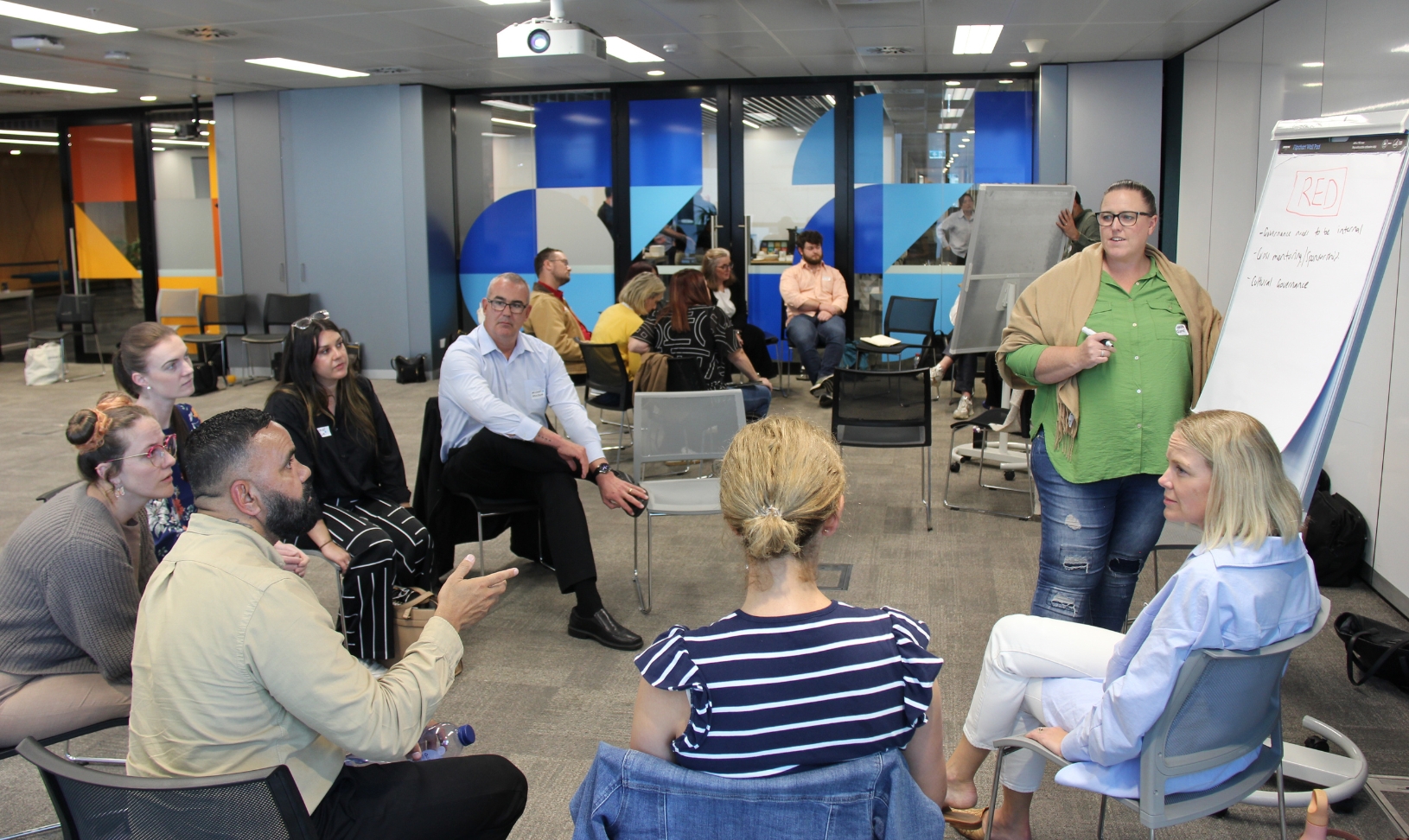 A Starlight employee and child smile and laugh at the camera