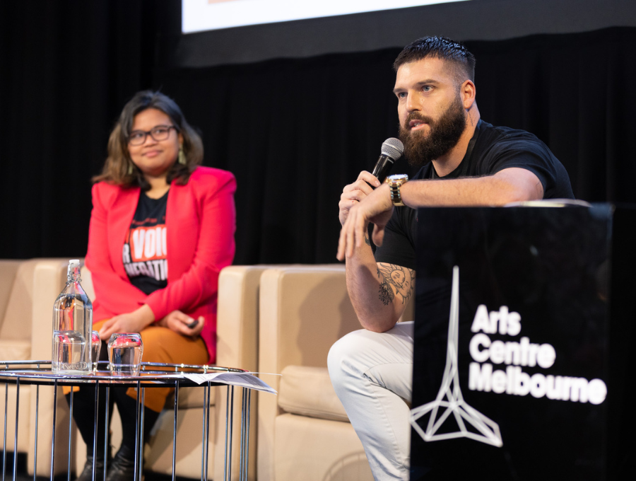 RAP staff members addressing a crowd at an event.